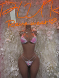 Two-piece animal-print dancewear set with chain trim, pink bra and thong