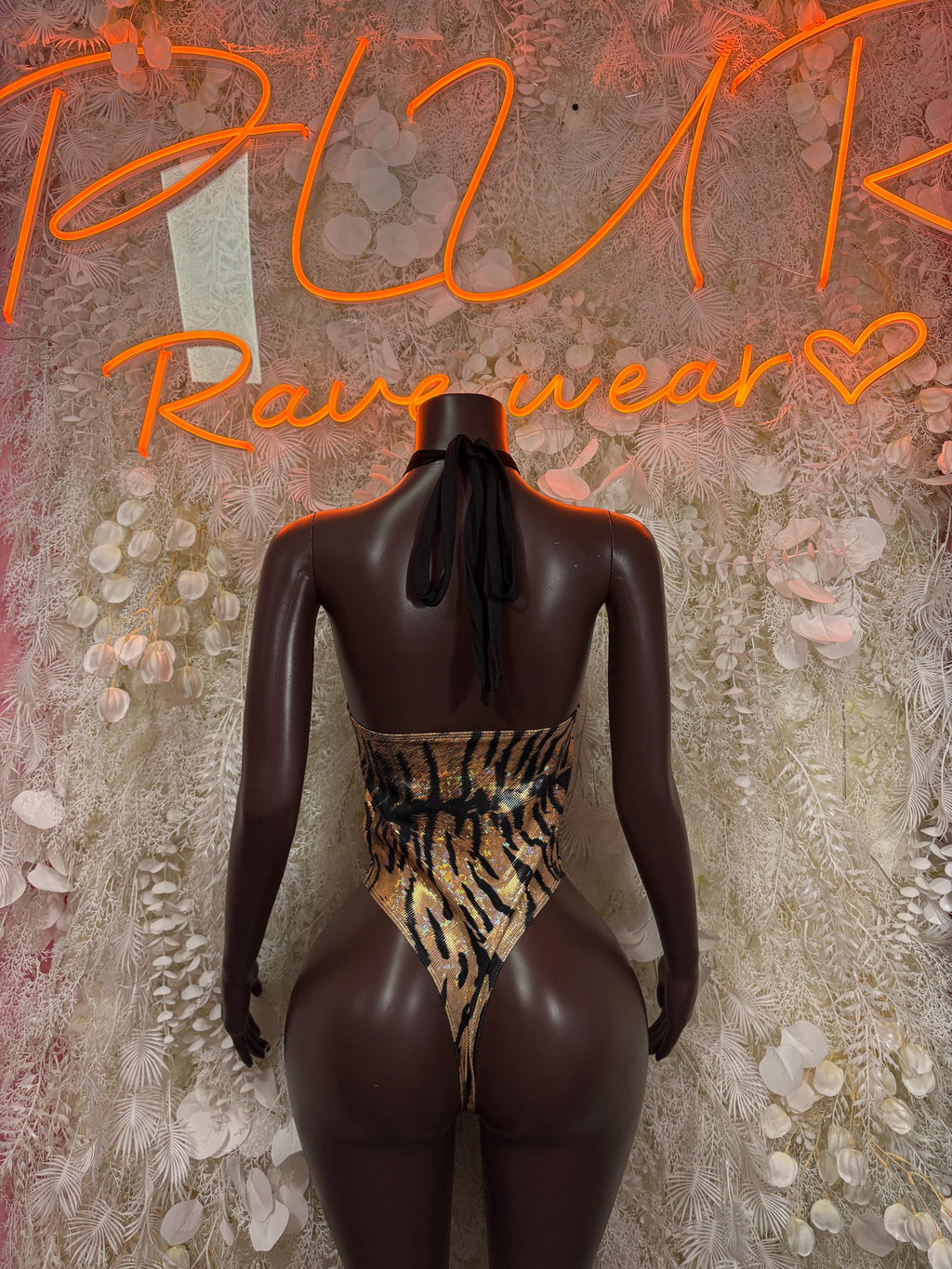 Tiger-print one-piece bodysuit with open back and high-cut legs