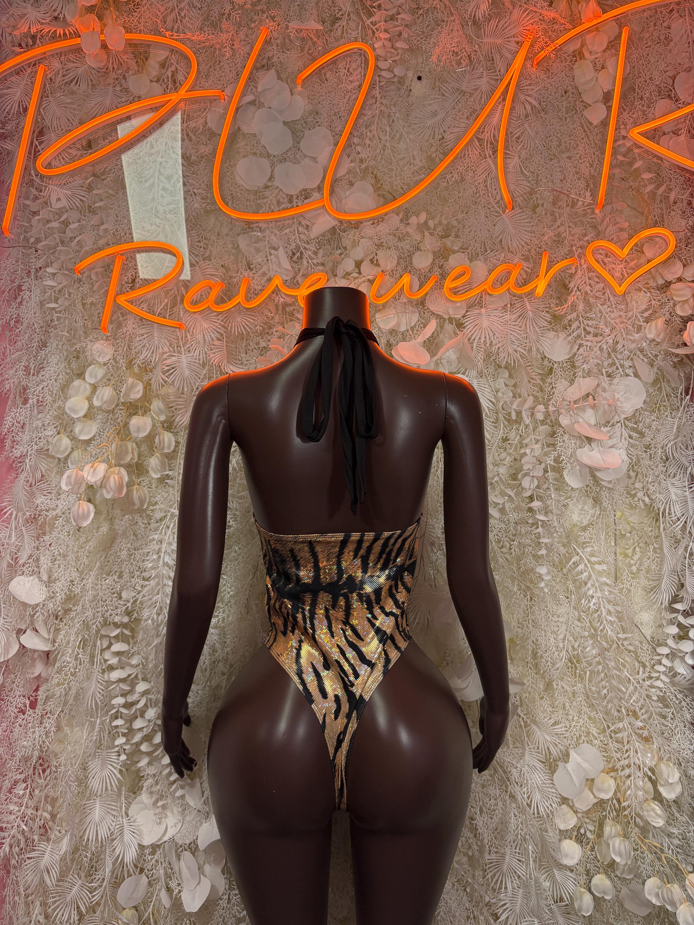 Tiger-print one-piece bodysuit with open back and high-cut legs