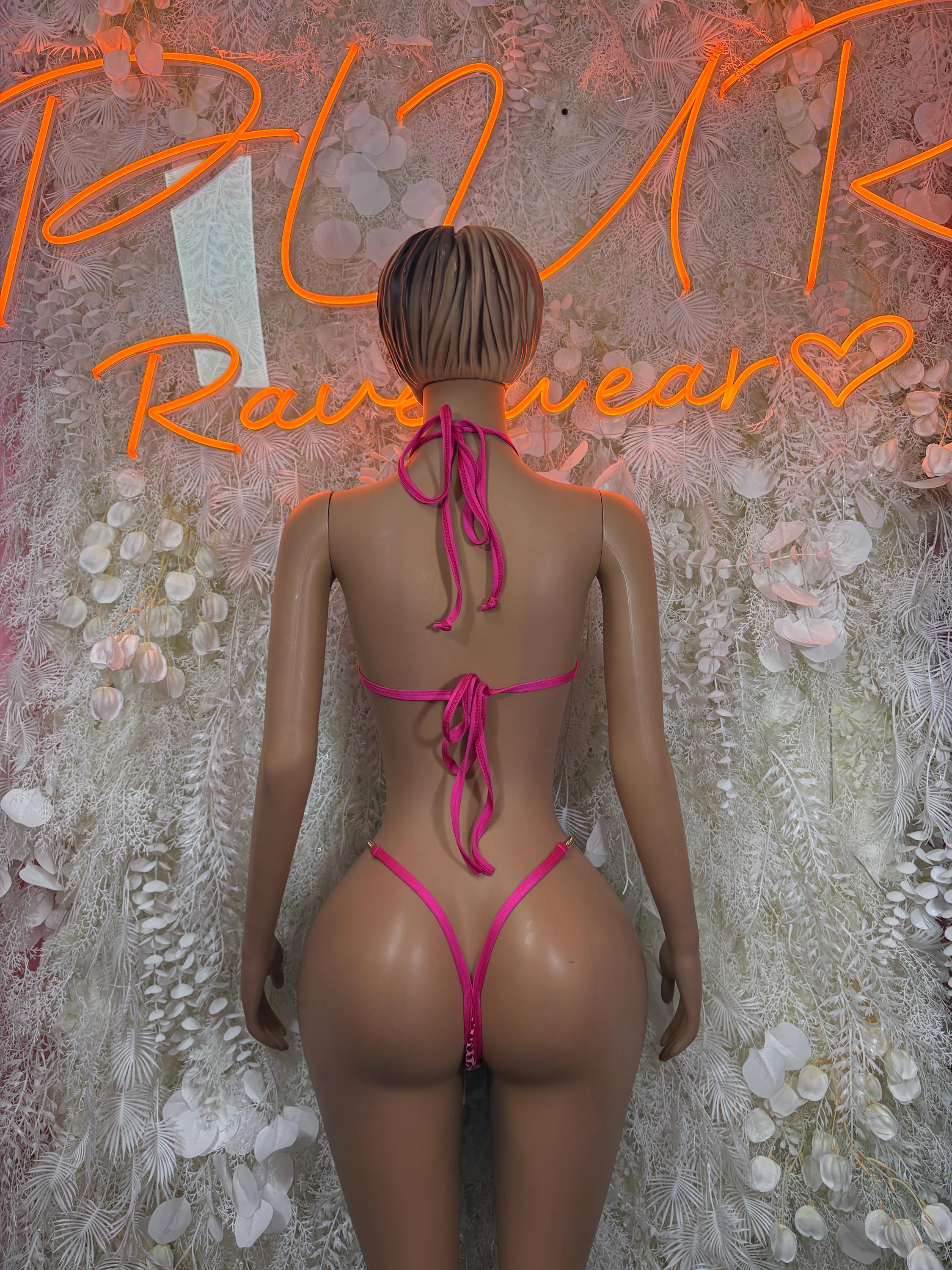 Pink cheetah-print one-piece bodysuit with open back and crisscross lace ties