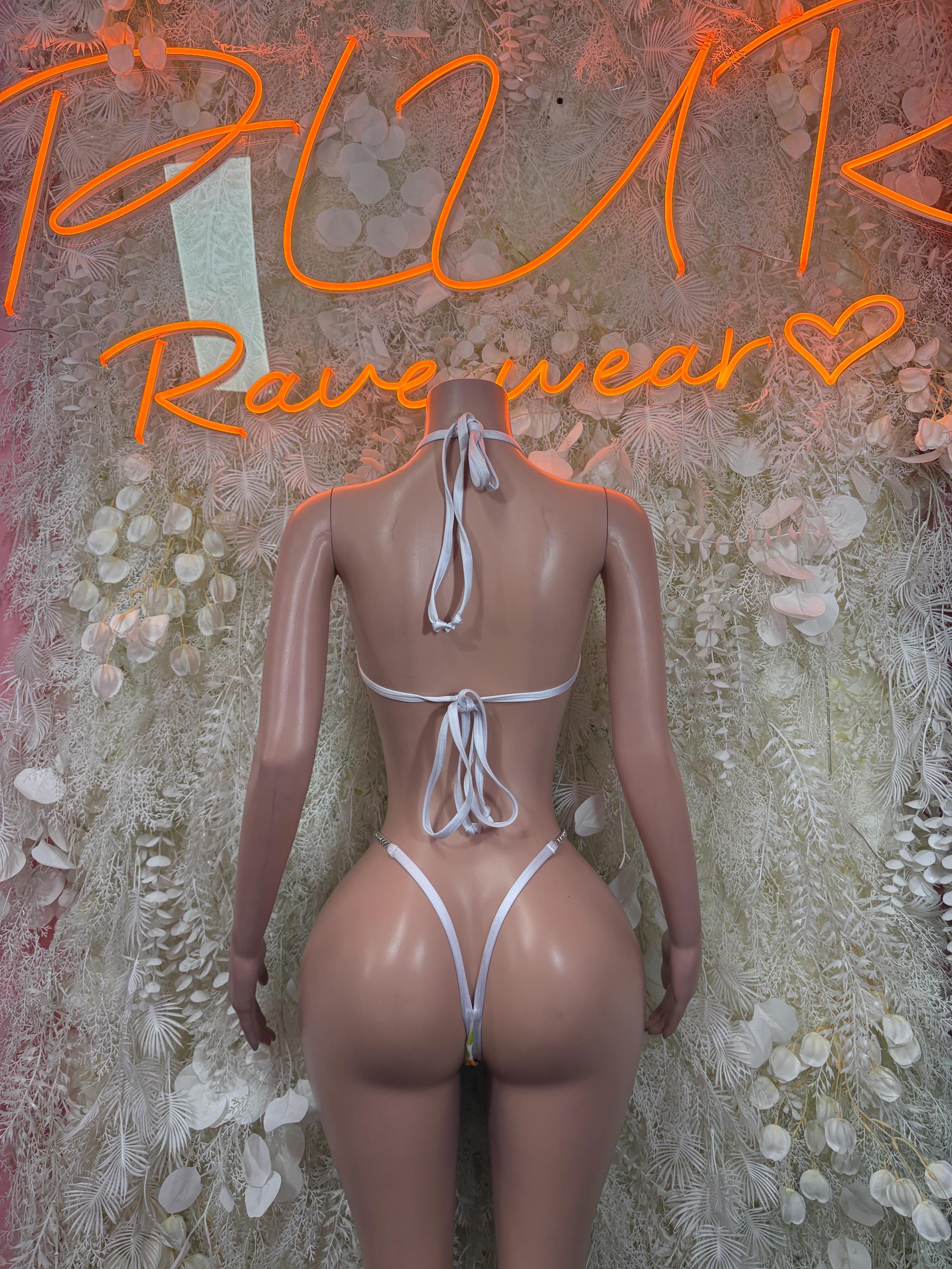 One-piece bodysuit with open back and white lace ties, minimal coverage