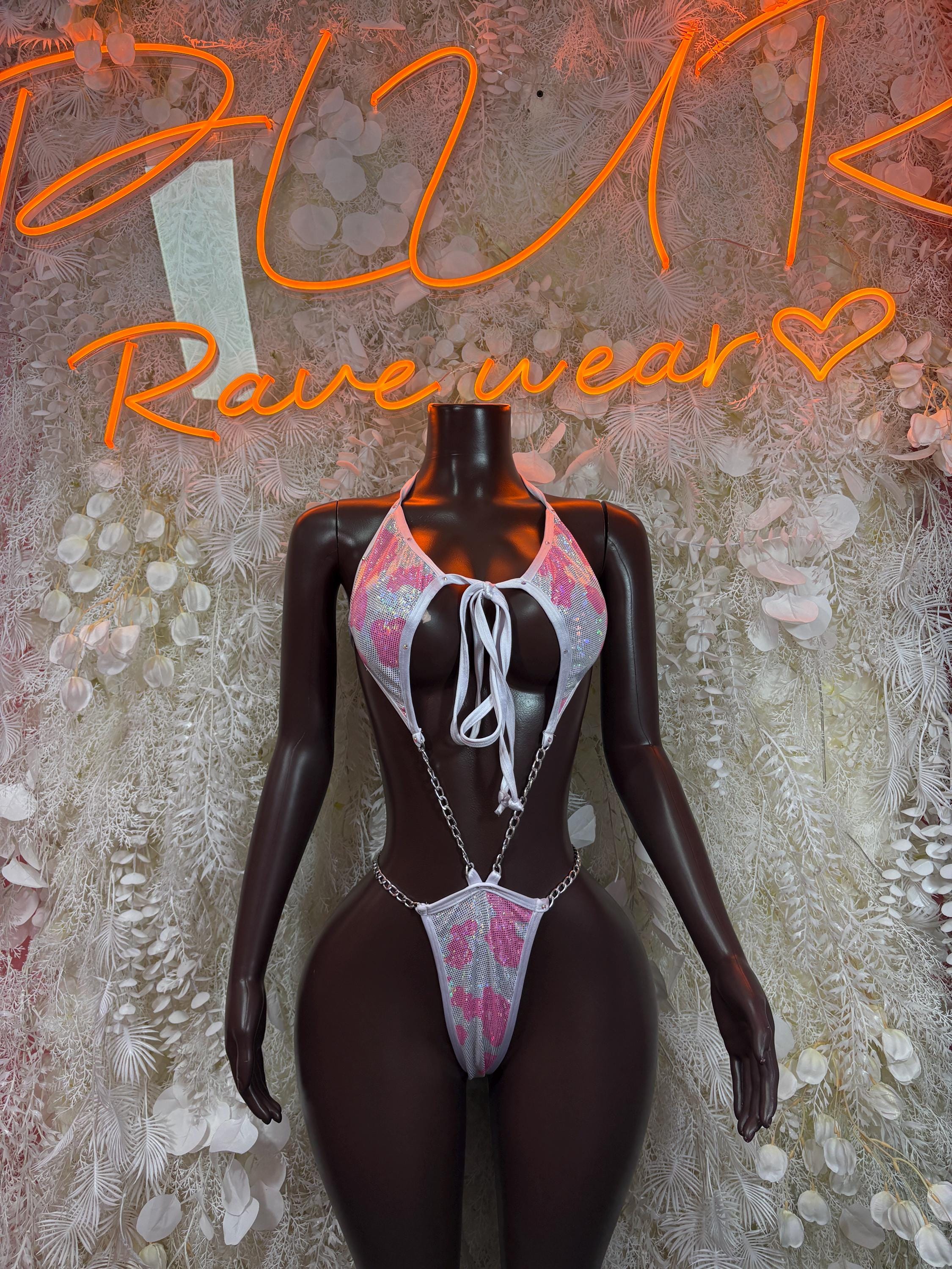 Cow-print one-piece bodysuit with halter tie and thong cut, pink and white accents