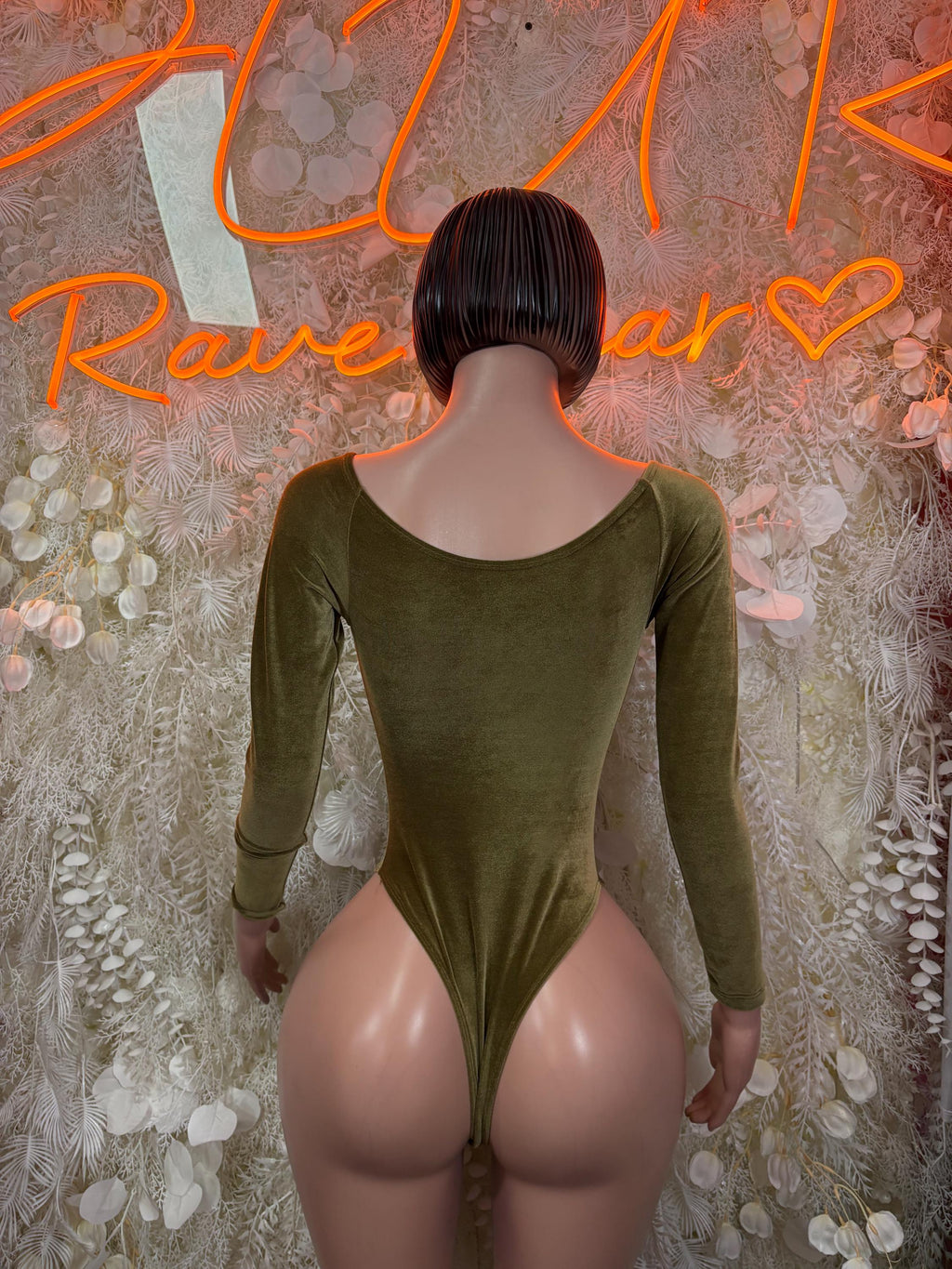 Velvet green long-sleeve bodysuit with scoop back, fitted stretch velvet.