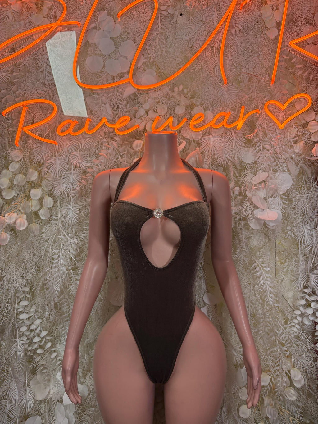 Velvet bodysuit with high-cut front, keyhole neckline, sleeveless, dark brown.