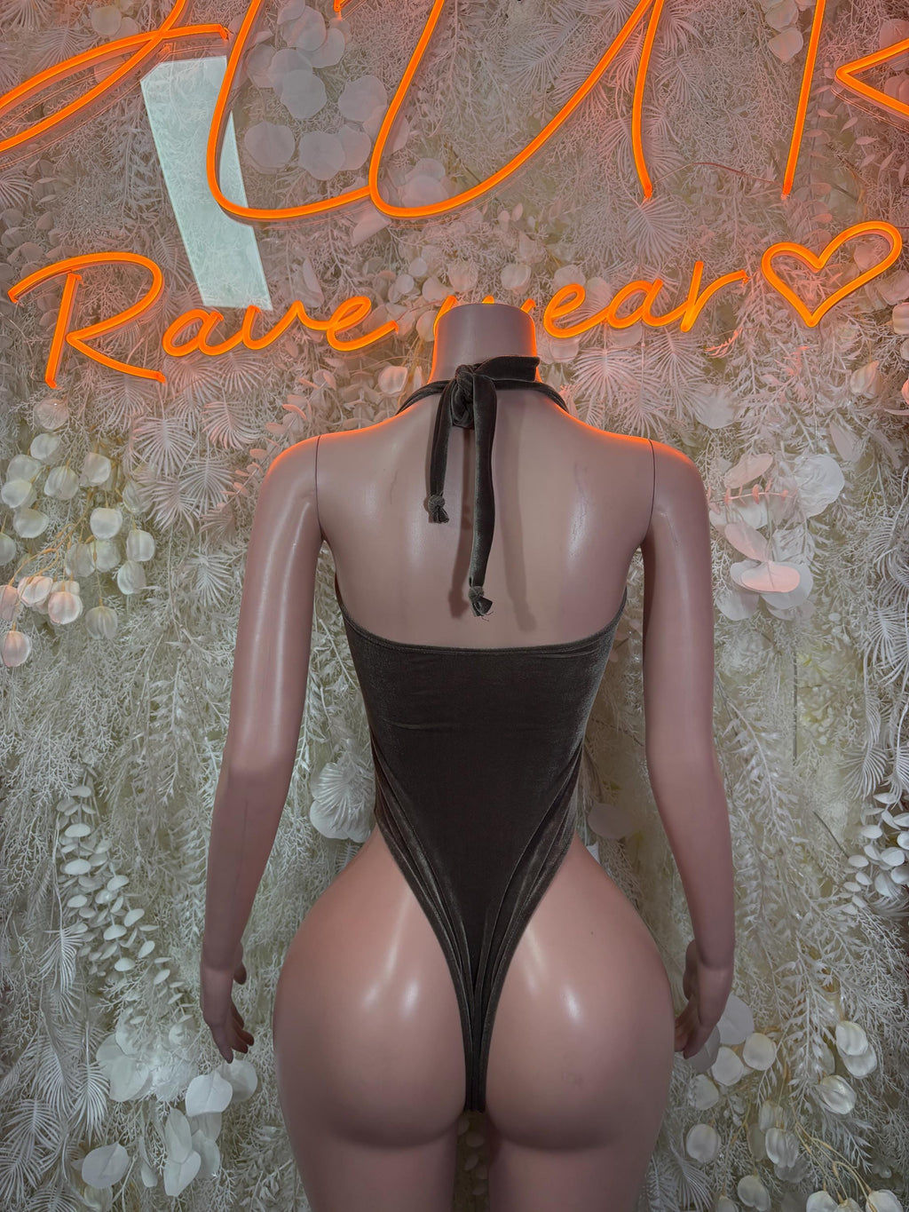 Velvet bodysuit back view, low back with keyhole strap detail, sleeveless, dark.