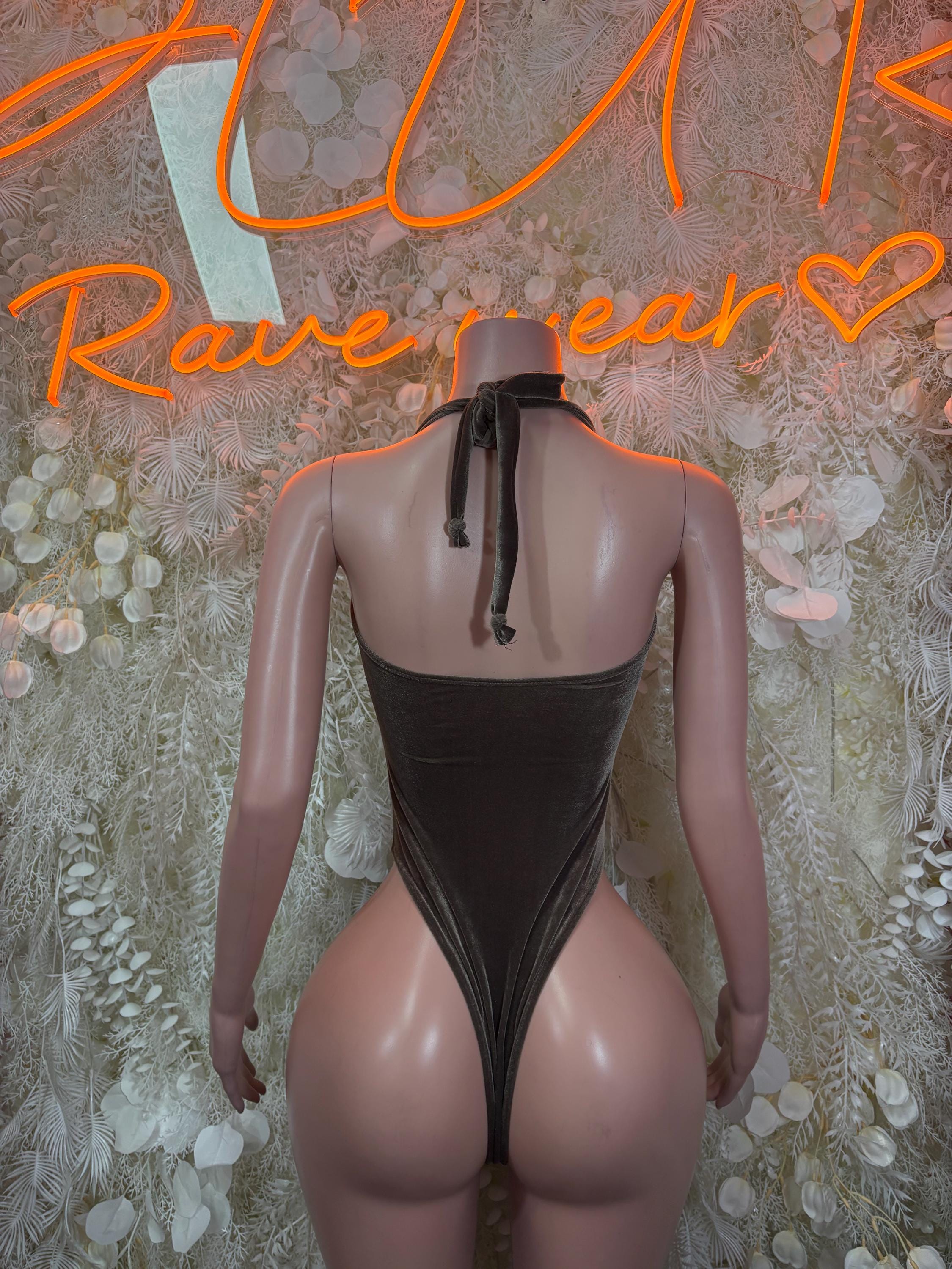Velvet bodysuit back view, low back with keyhole strap detail, sleeveless, dark.