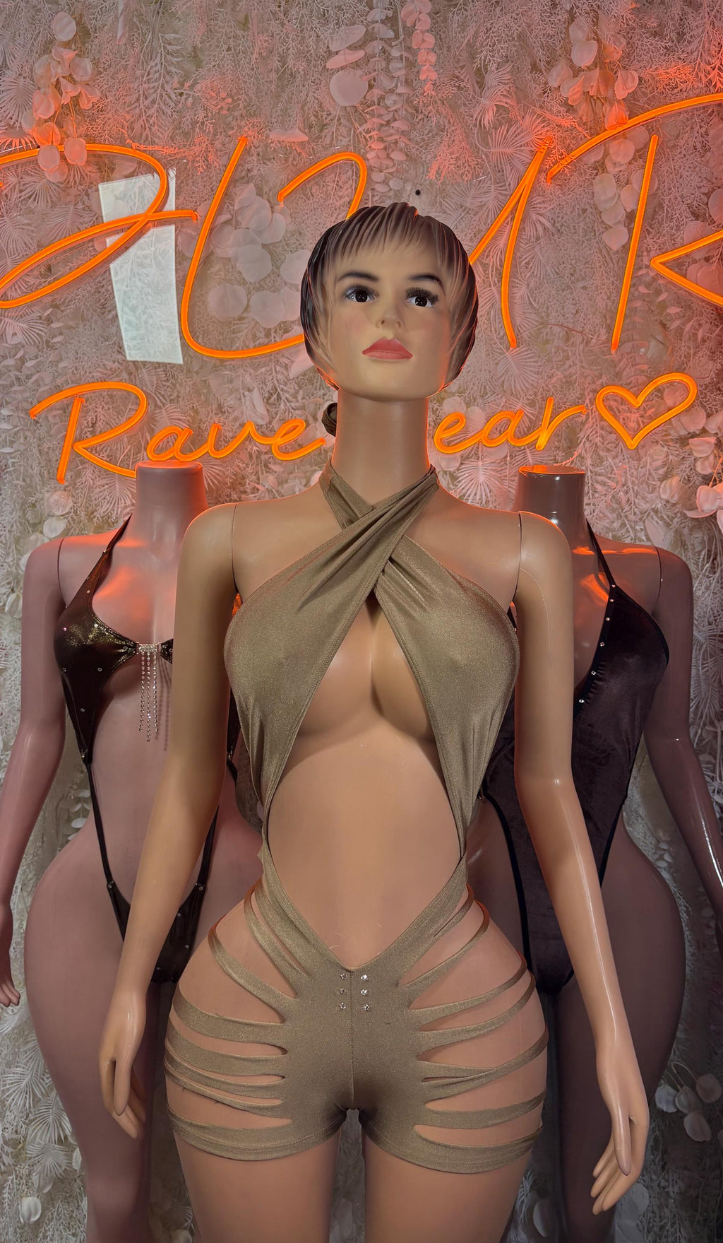 Gold one-piece club bodysuit with draped halter top and strappy cutout sides