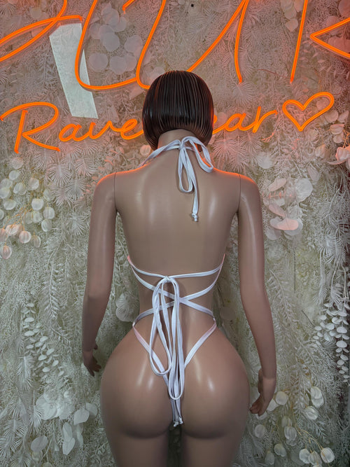 Back view of green bodysuit with white trim and long tie strings