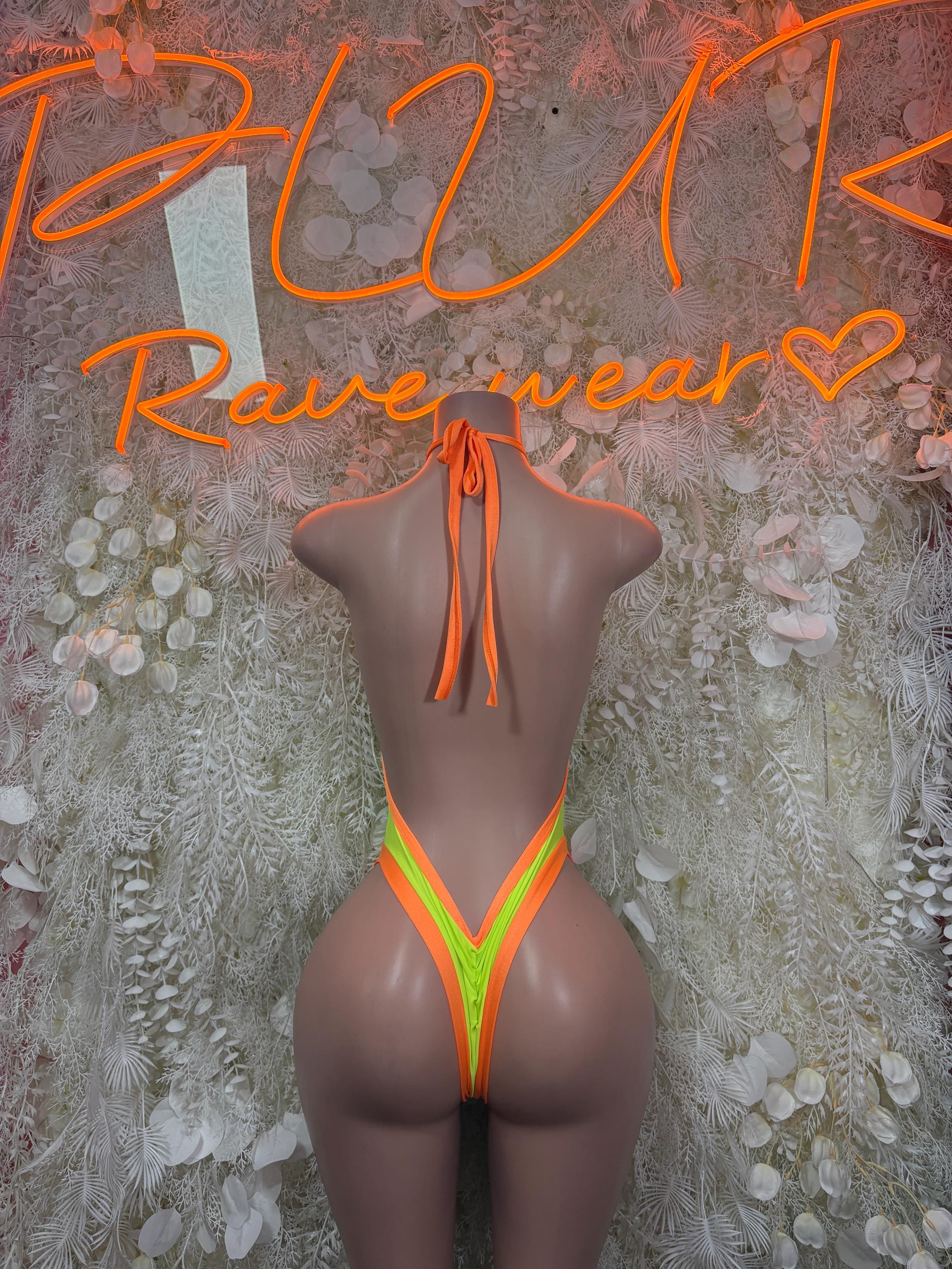 Neon green bodysuit with orange trim, halter back ties and high-cut