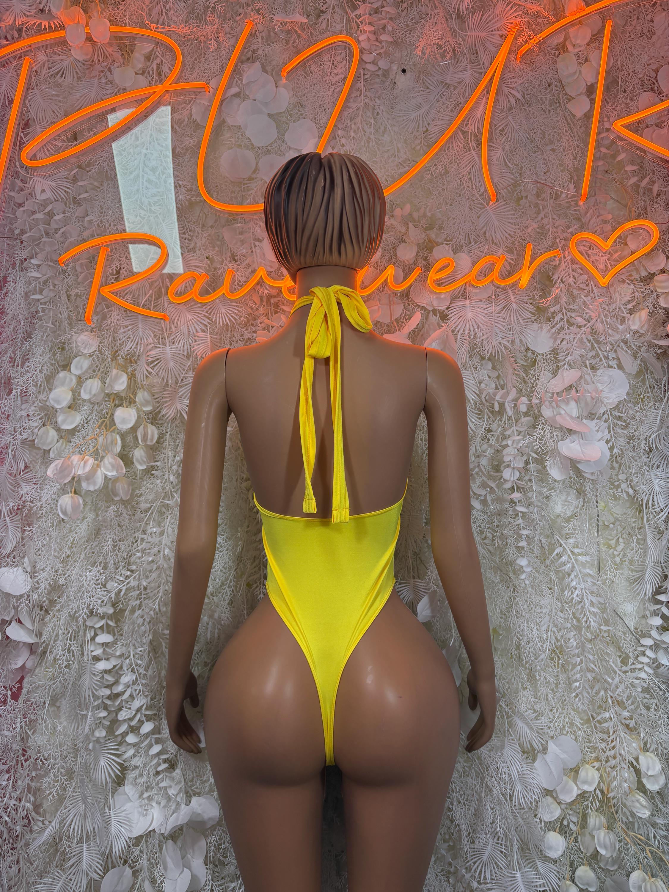 Yellow backless bodysuit with halter tie straps, open back view
