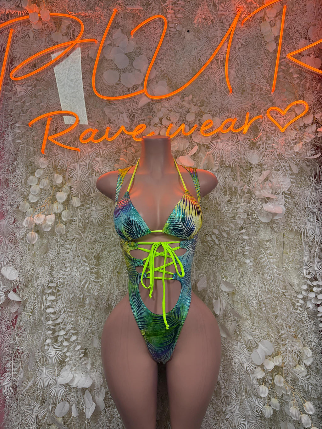 Neon tropical print bodysuit with halter neckline and neon green lace-up sides