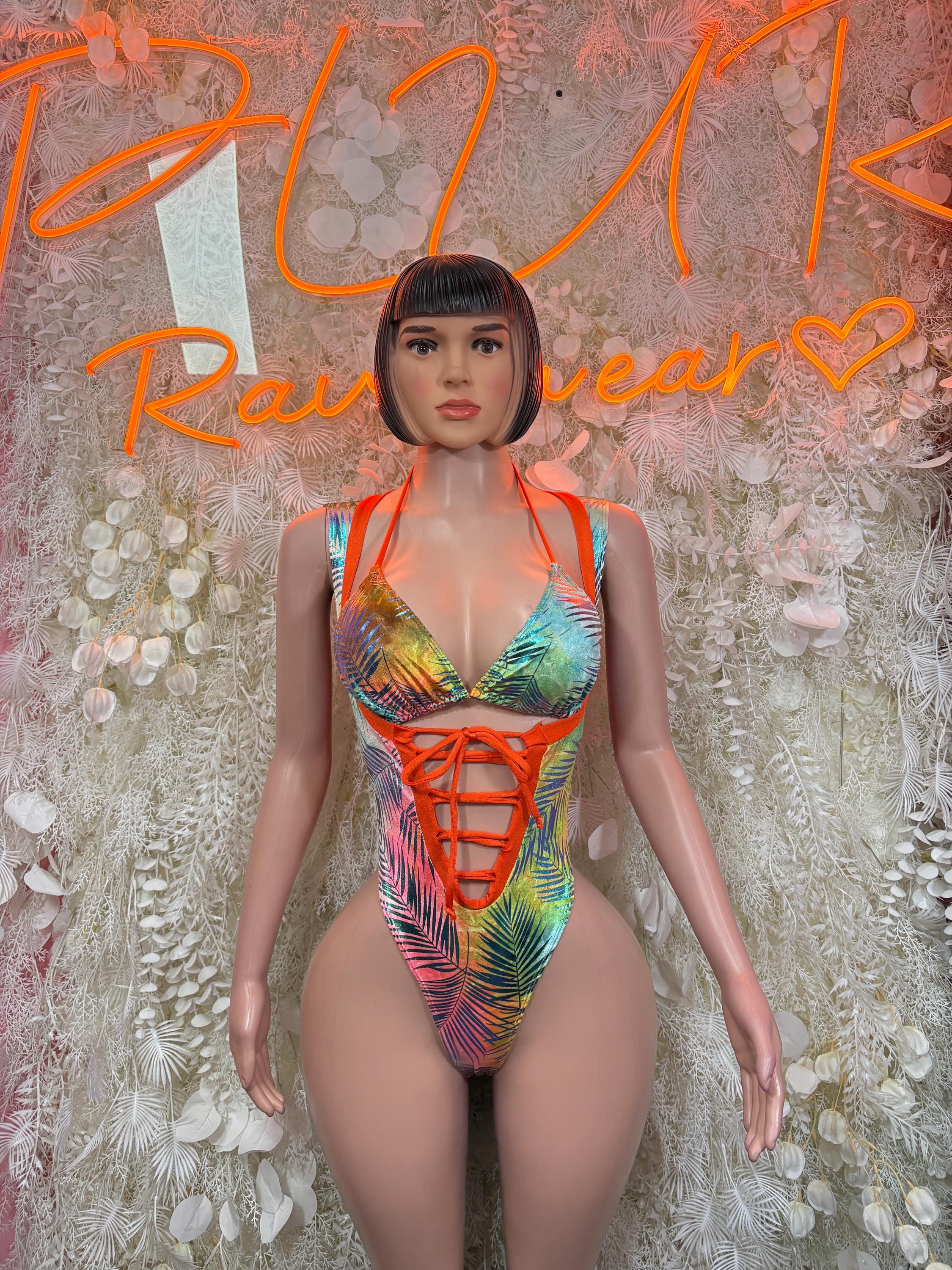 Women's tropical print bodysuit with orange lace-up front and rainbow leaf pattern