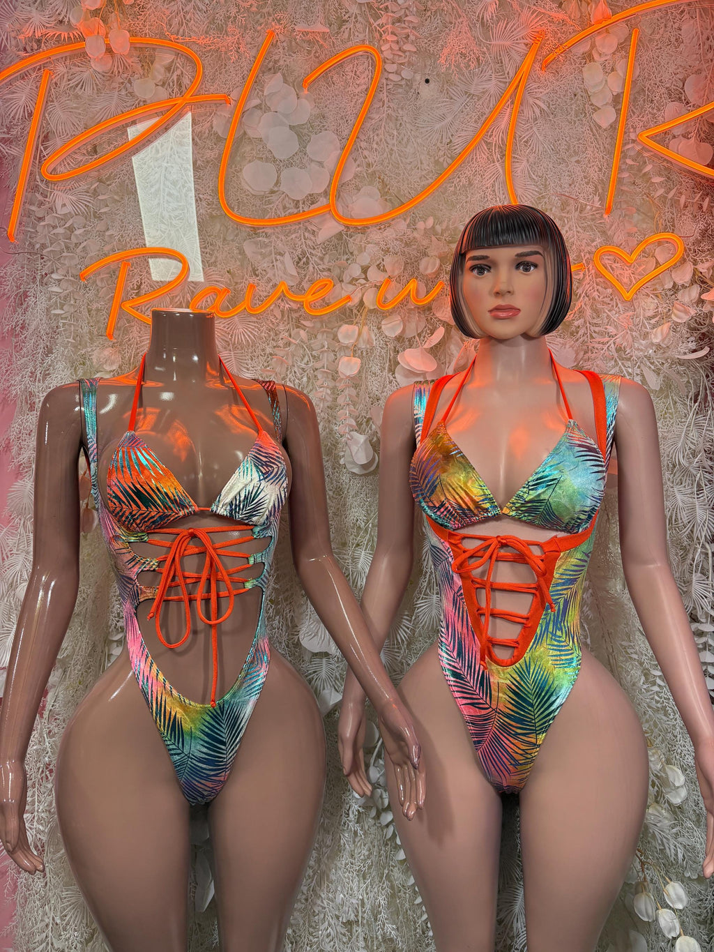 Women's tropical print bodysuit shown front and back: rainbow leaves with orange lace-up