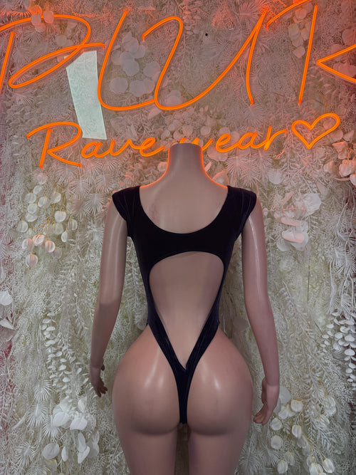 Purple velvet bodysuit with open back and strappy V-shaped back, long sleeves