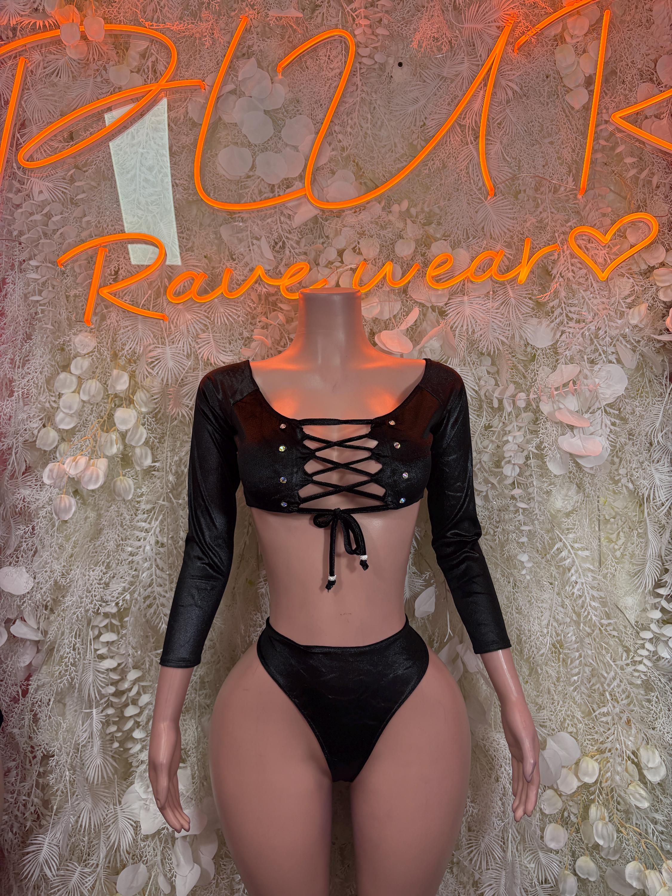 Black two-piece dancewear set with long sleeves, lace-up crop top and thong bottoms
