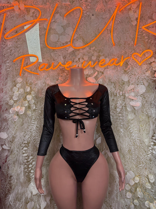 Black two-piece dancewear set with long sleeves, lace-up crop top and thong bottoms
