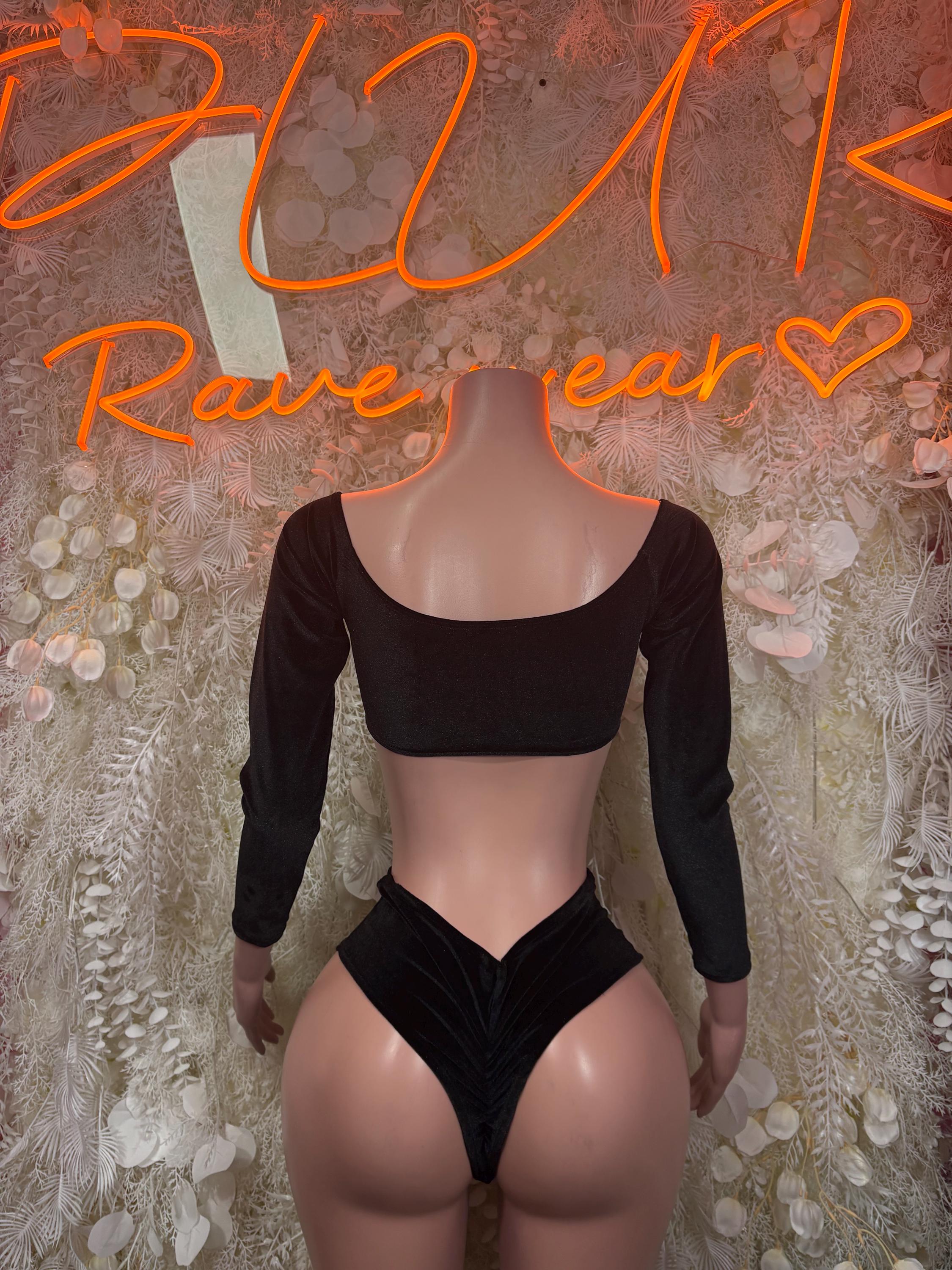 Black long-sleeve crop top with scoop back and high-cut bottoms