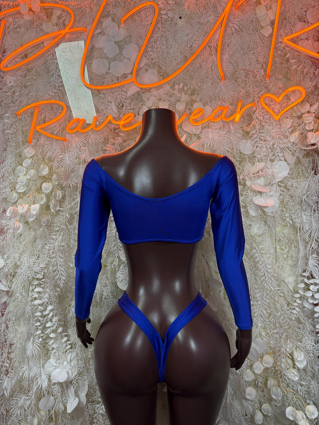 Royal blue two-piece dance set, back view: long-sleeve crop top and strappy bottoms