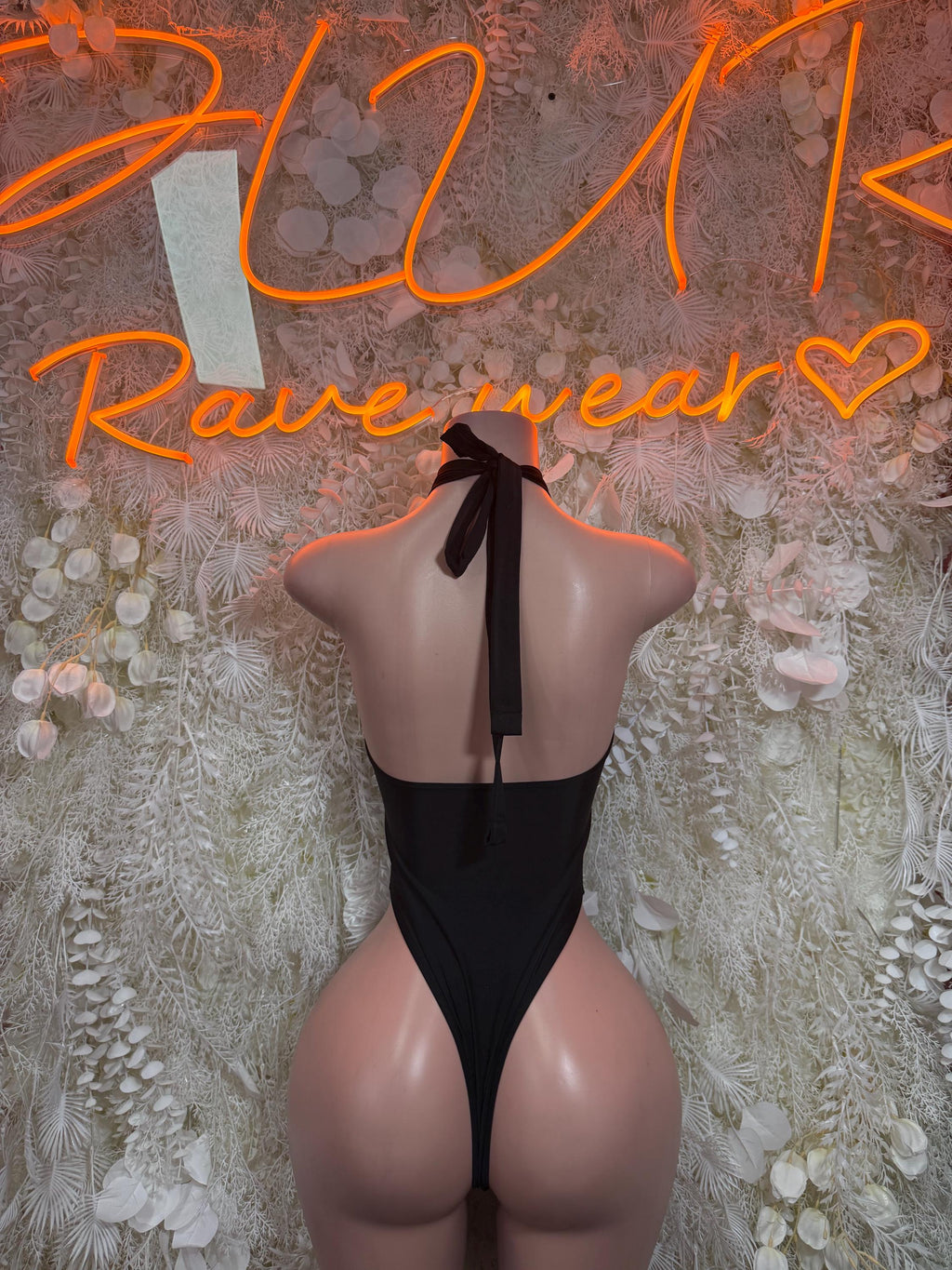 Black lace-up cutout bodysuit, open back with halter tie and vertical cutout