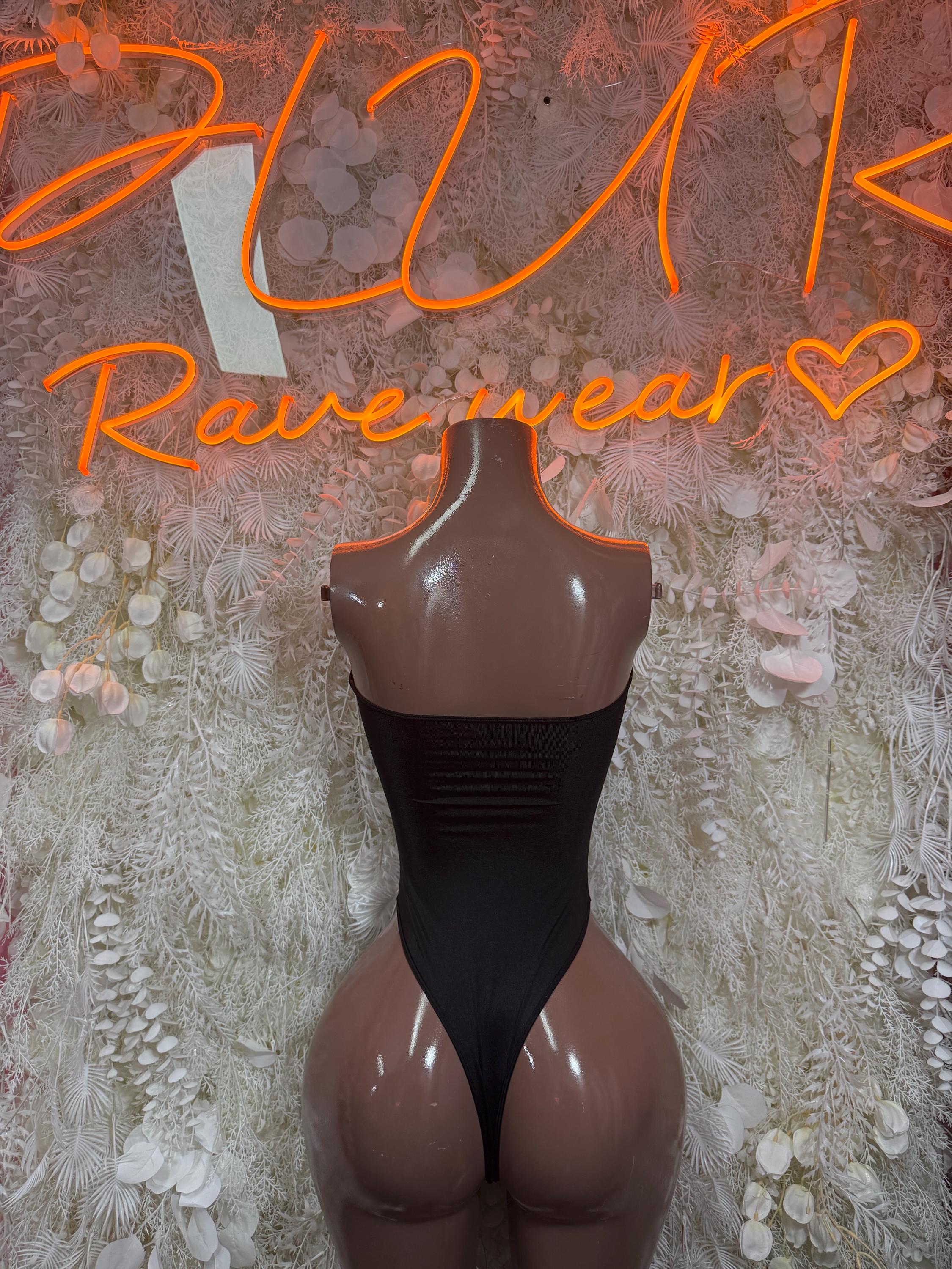Black cutout bodysuit with high-rise front and open chest cutouts on mannequin