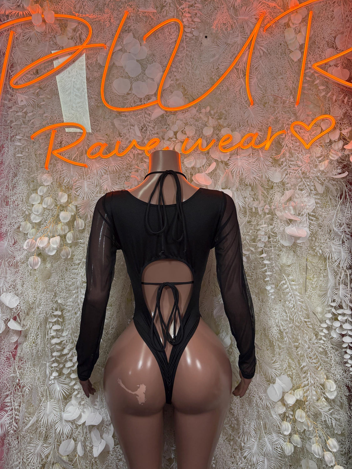 Black metallic cheetah bodysuit with sheer long sleeves and crisscross open back