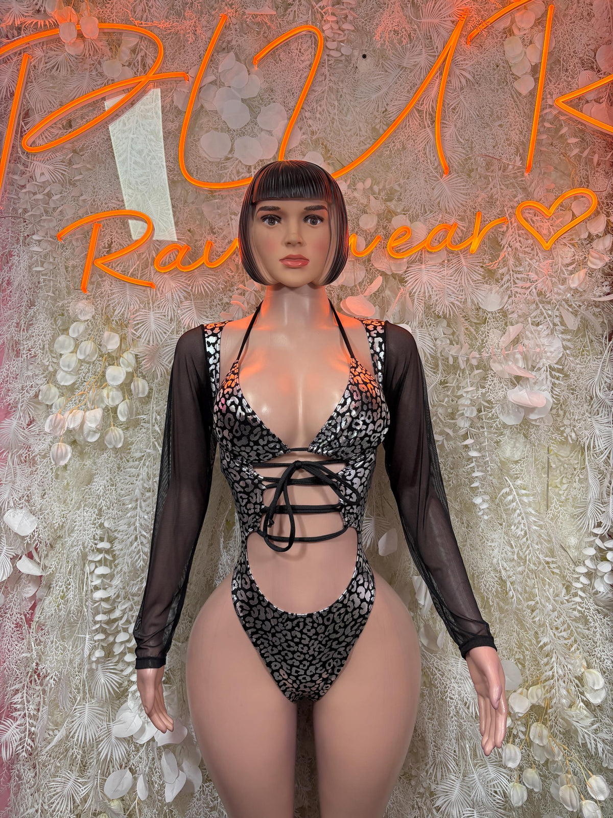 Leopard-print one-piece bodysuit with lace-up cutout, sheer long sleeves, dark metallic look
