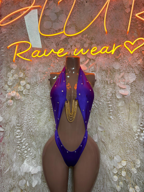 Purple one-piece dance bodysuit with high-cut legs and glitter strap accents