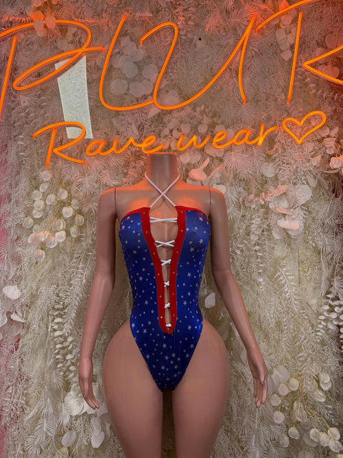Patriotic one-piece bodysuit with blue star print, red-and-white panel trim, deep V