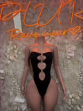 Black strapless bodysuit with vertical heart cutouts and metal ring accents
