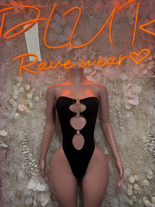Black strapless bodysuit with vertical heart cutouts and metal ring accents
