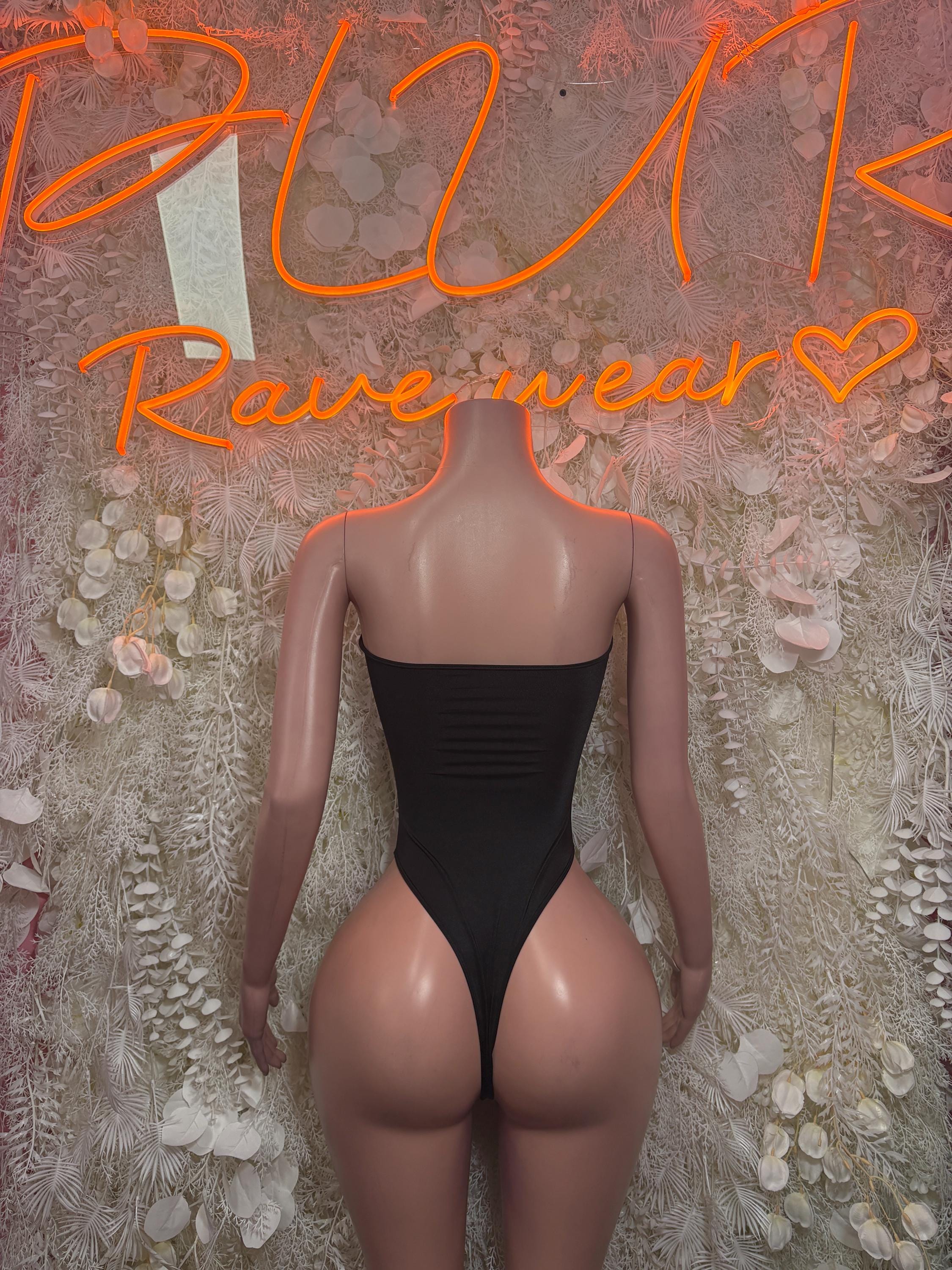 Black one-piece bodysuit back view with halter straps and seam-textured back panel