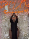 Black halter maxi gown with plunging neckline and sheer dot detailing
