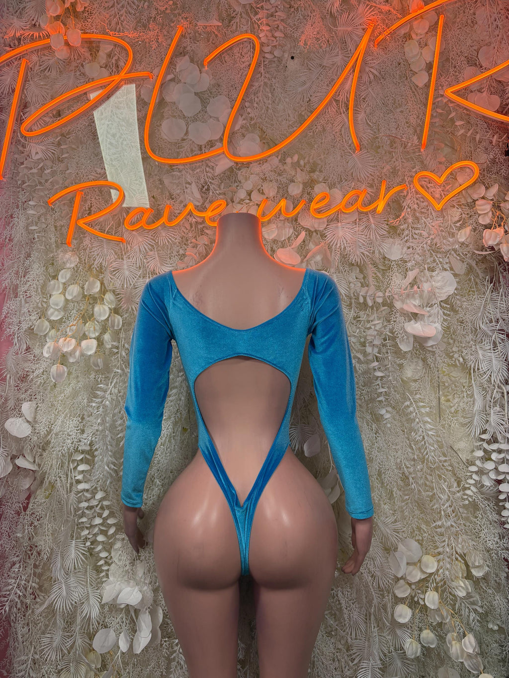 Blue velvet cutout bodysuit with long sleeves and V-back with open back