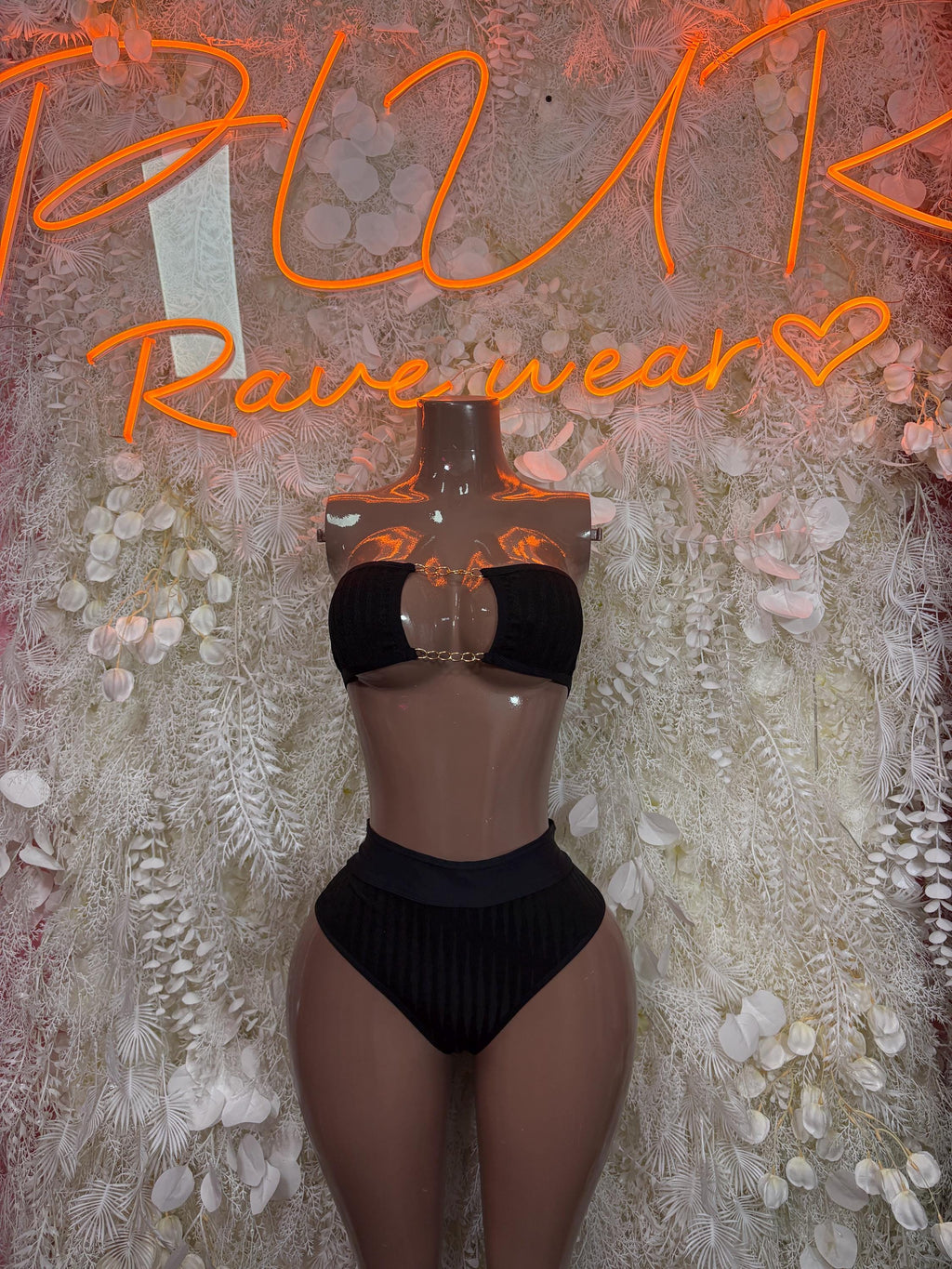 Black two-piece lingerie set with lace bralette and high-cut bottoms
