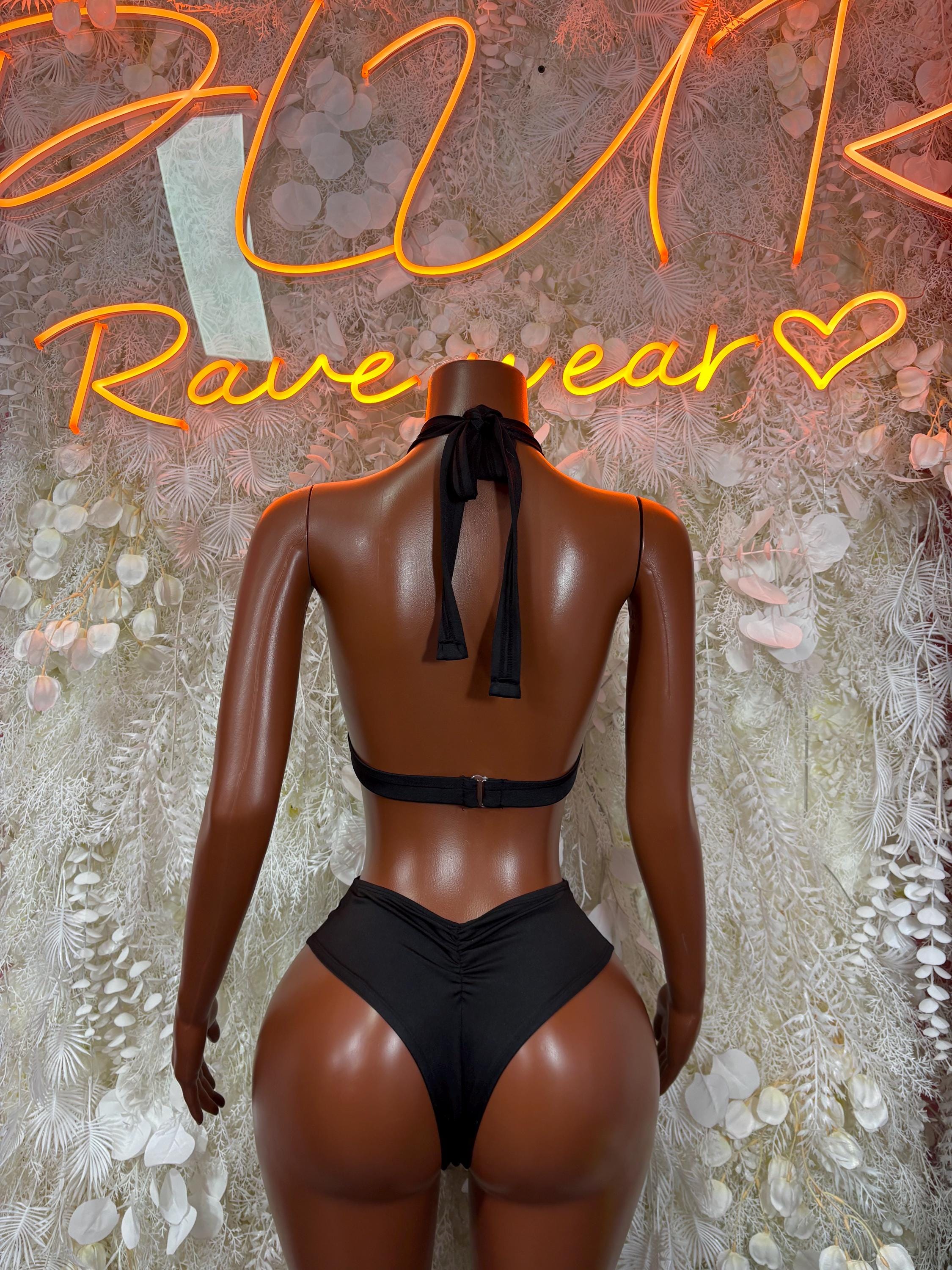 Black two-piece rave set with halter bra tie-back and black high-cut bottoms