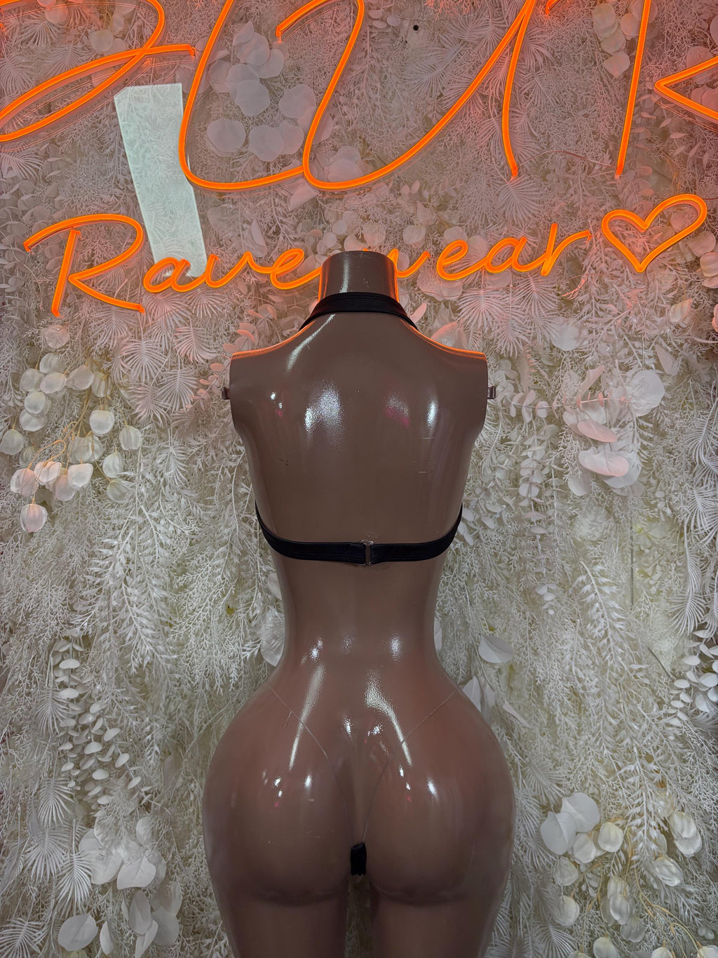 Black two-piece rave outfit with sparkle-trim top and thong briefs, open back