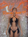 Black fringe two-piece rave outfit with halter bra and tie bikini bottoms, front view