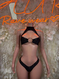 Black rave two-piece set: ring-detail halter top and matching high-cut bottoms