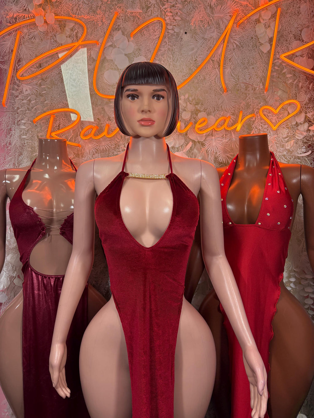 Burgundy velvet halter bodysuit-style gown with front cutout V neckline
