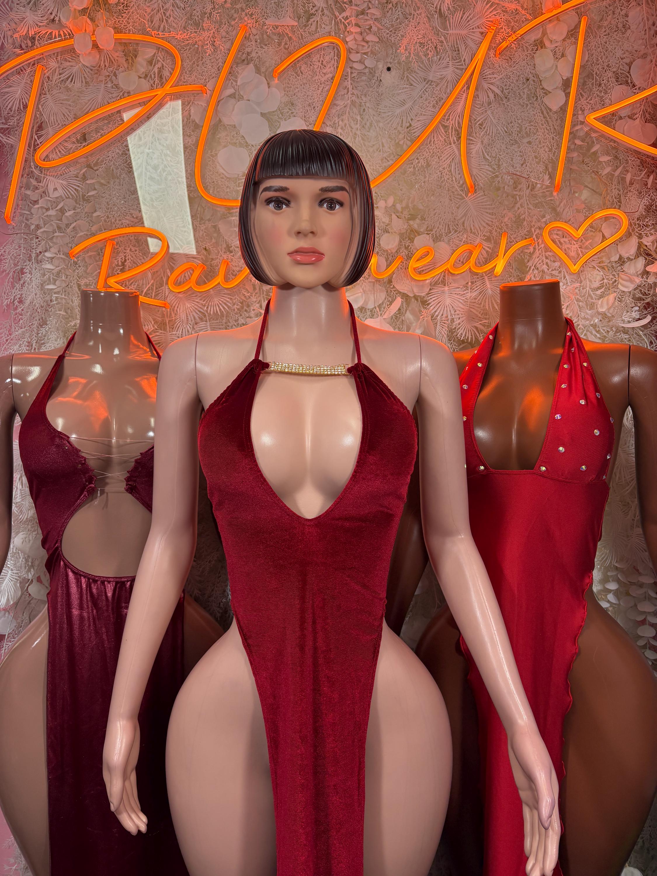 Burgundy halter satin mini gown with rhinestone trim, plunging V, and open sides