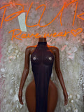 Dark halter gown with jeweled chest accents and high-cut thigh silhouette