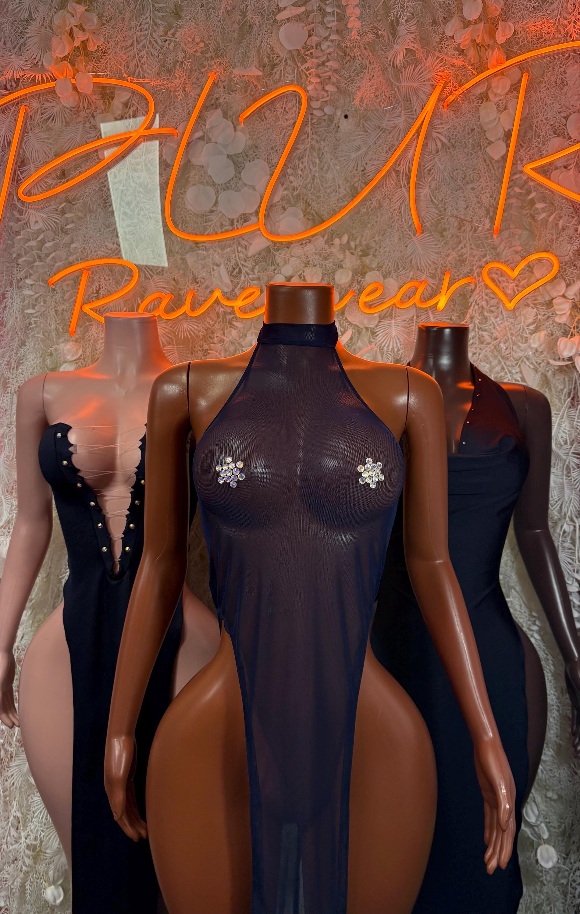 Dark halter gown with jeweled chest detail, paired with another gown behind