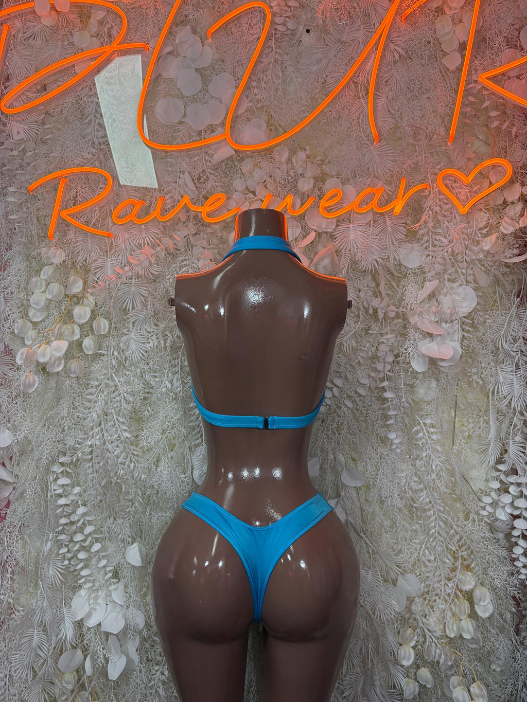 Blue lace two-piece rave swimsuit on mannequin, back view with lace bra
