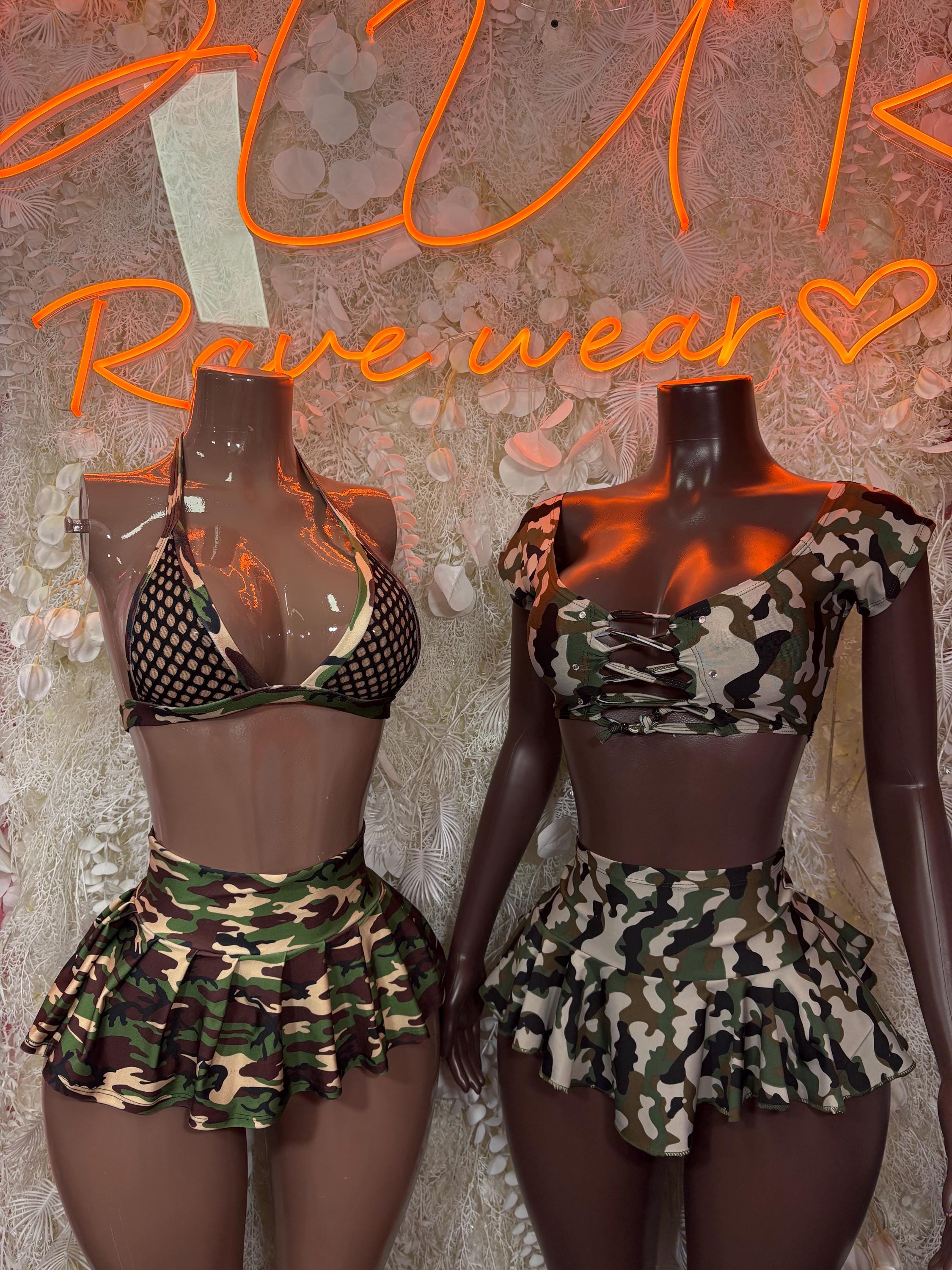 Camo print two-piece skirt set shown on two mannequins: peplum crop top and mini skirt