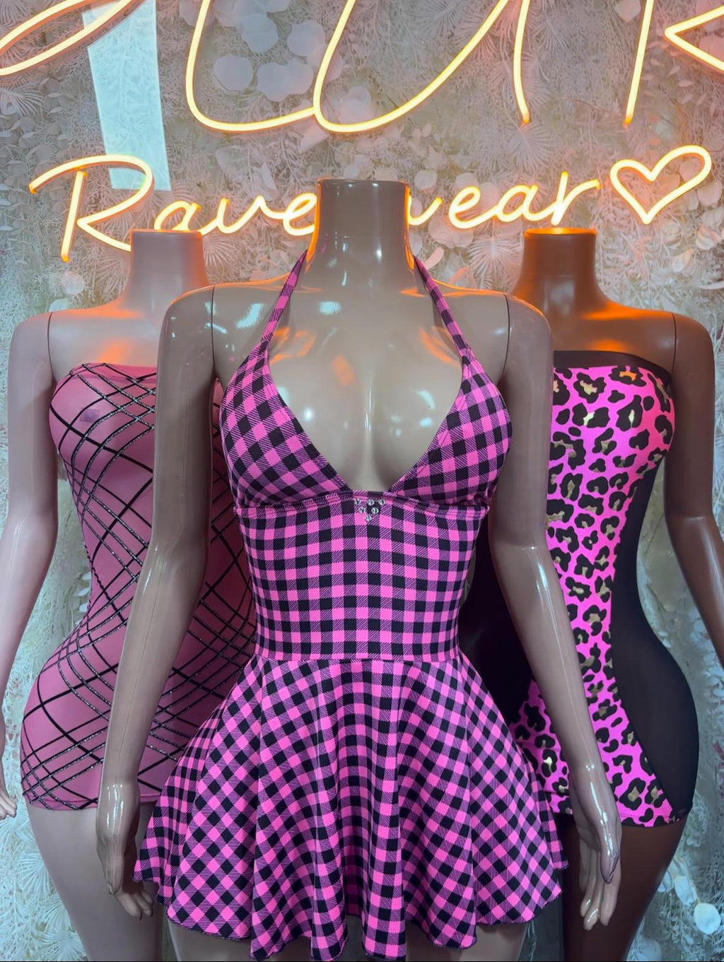 Pink gingham halter mini dress with deep V-neckline and gathered skater skirt