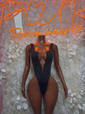 Black lace-up bodysuit with deep V neckline and high-cut legs