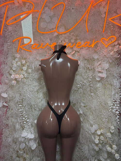 Black halter bodysuit with open back cutout and thin shoulder straps