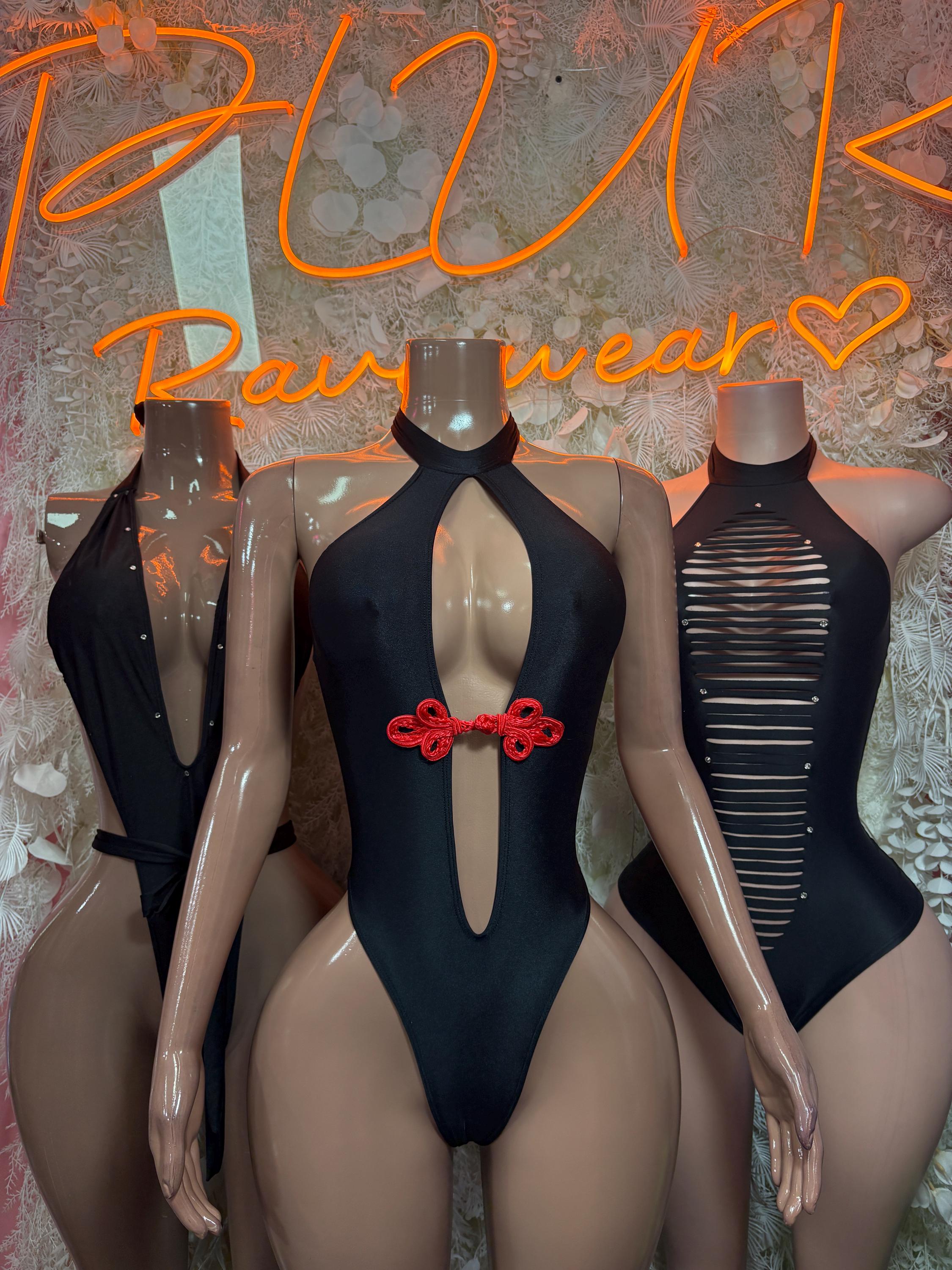 Black halter bodysuit with oval chest cutout and red bow front detail