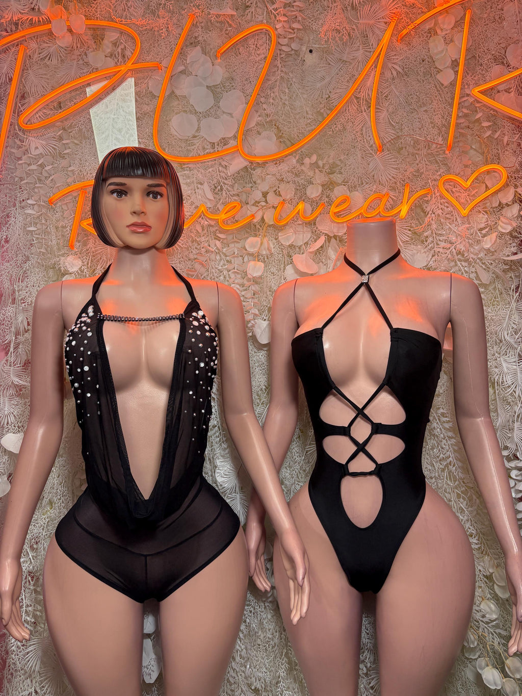 Two black bodysuits: sparkle-trim V-neck and crisscross back cutout design