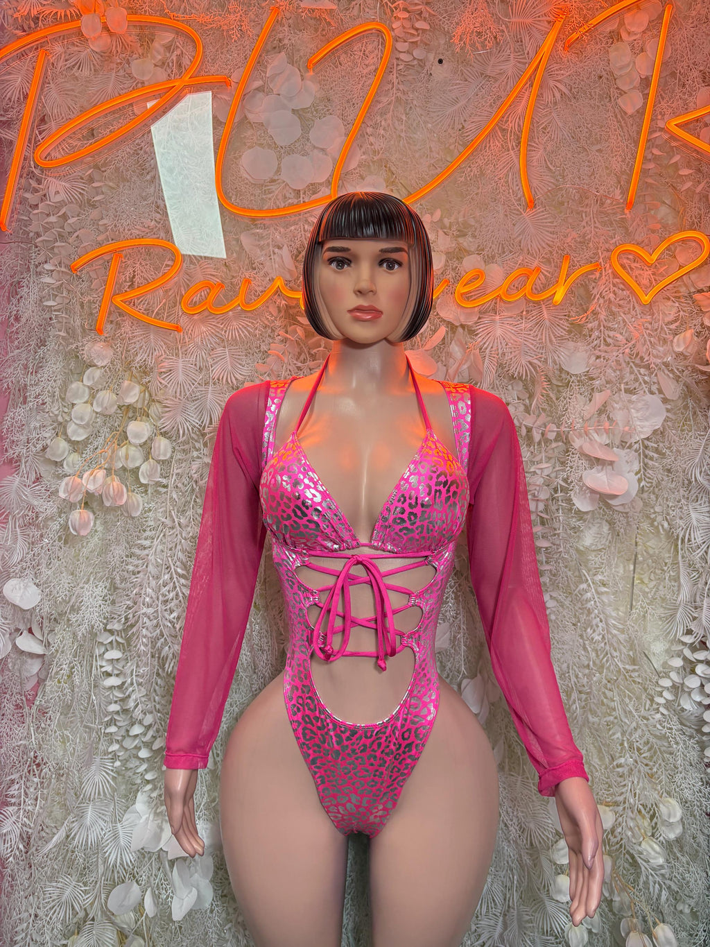 Pink cheetah-print metallic bodysuit with lace-up cutout and long sheer sleeves